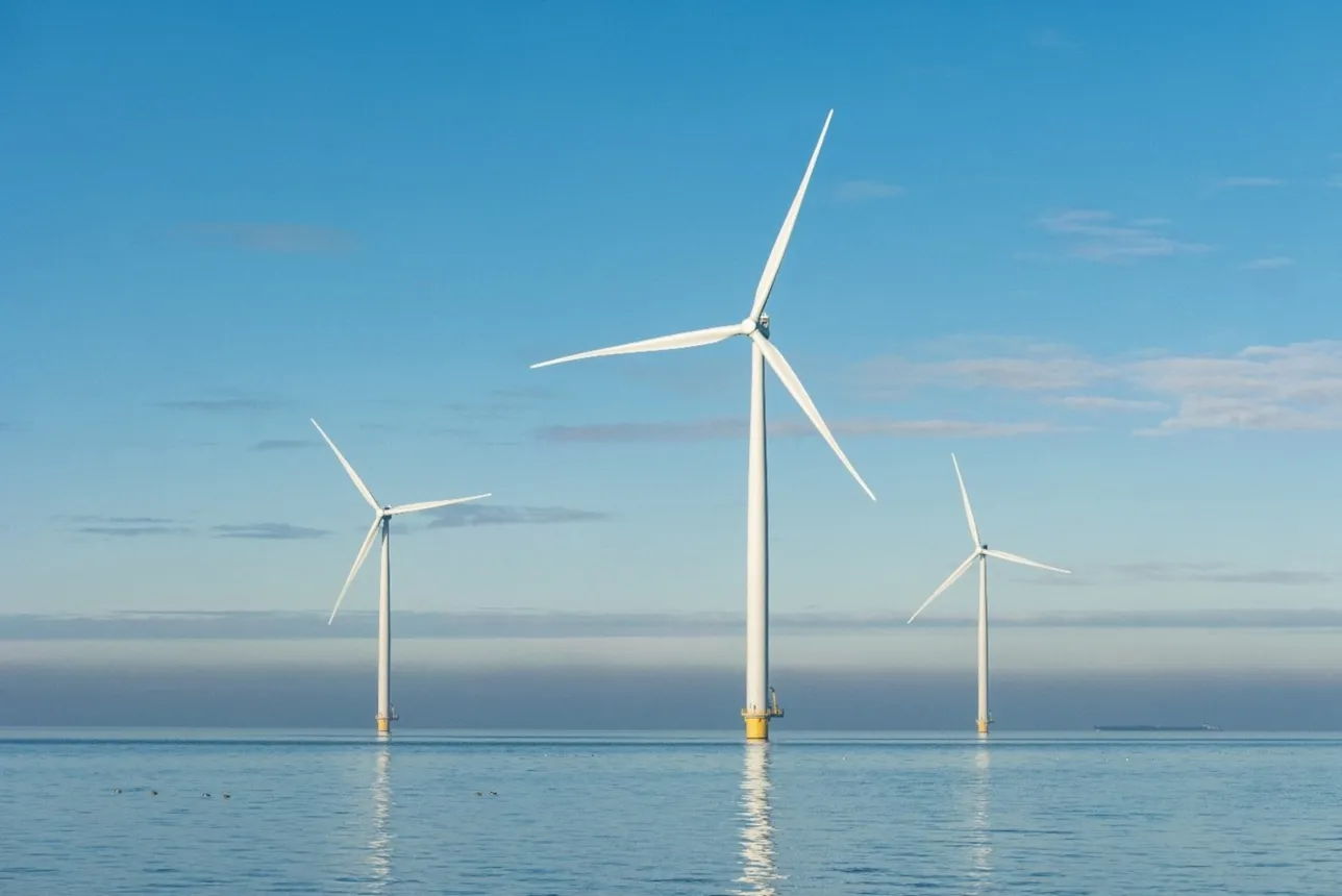 three offshore wind turbines