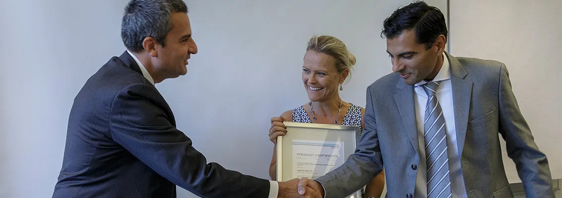 Orkla Health exectuives receive certificate from DNV GL - Business Assurance CEO Luca Crisciotti