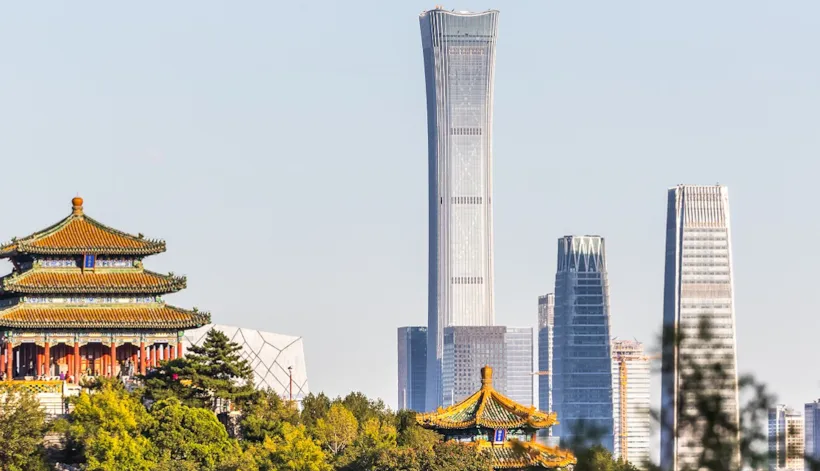 Contrast between the historic Wanchun Pavilion in Jingshan Park in front and the modern CITIC Tower which is the highest building in Beijing